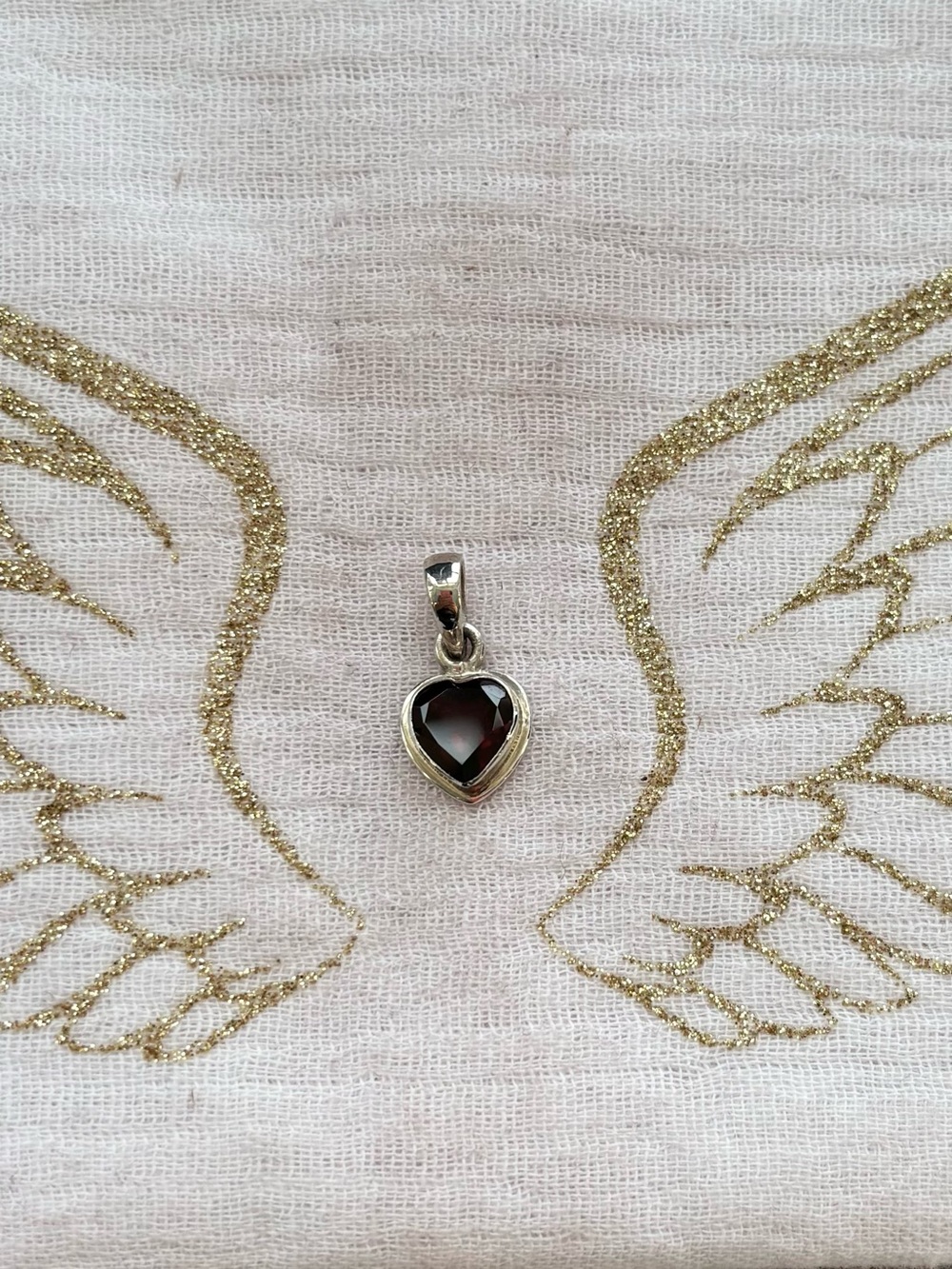 Heart-Shaped Garnet Pendant in Sterling Silver